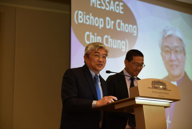 Bishop and interpreter Rev Jasper Sim